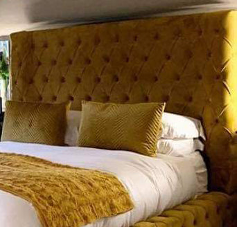 Samiraq Mustard Dreamscape Bed - Chesterfield Bed in Mustard Velvet with 54-Inch Wave Padded Headboard, 10-Inch Footboard, Triple Layer Foam, Optional Gas Lift Storage, Custom Sizes & Free UK Delivery - Perfect for Luxury Bedrooms